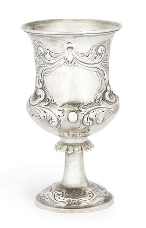 A Victorian silver goblet, London c.1862, Thomas Smiley, of ogee form, chased with scrolling foliage, fruit and flowers around a vacant cartouche, cast leaf mi