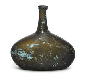 
	
		A brown green wine bottle, 18th century, of long rectangular squat form, 19cm high
		