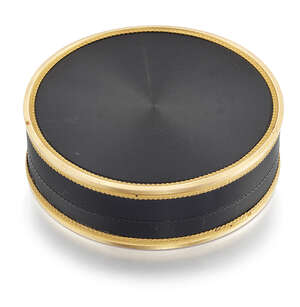
	
		An early 19th century gold mounted Bois Durci and tortoiseshell circular trinket box, 