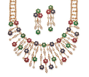 A gem-set floral necklace and earring set, the fringe necklace composed of graduated drops, each...