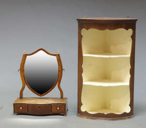 
	
		A late Georgian dressing table mirror with shield plate and three drawer serpentine base,...