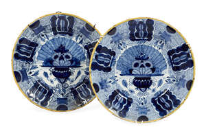 
	
		A pair of 18th century Dutch blue and white Delft Peacock plates, bears marks to verso,...
