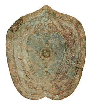 
	
		A Chinese bronze leaf-shaped 'owl' mirror, Shang dynasty, decorated with a stylised owl...