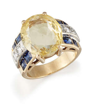 
	
		A yellow sapphire, diamond and synthetic sapphire ring,  the oval mixed-cut yellow...