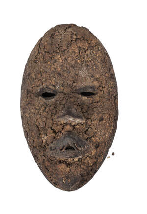 
	
		A Tribal mask of a man, probably late 19th/early 20th century,  with narrow eyes and...