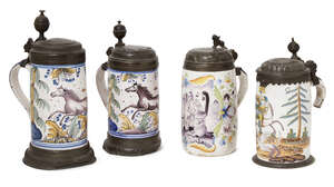 
	
		Four 18th century German polychrome faience tankards, each with pewter mounts, painted...