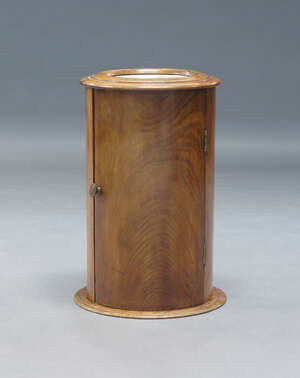 
	
		A Victorian mahogany bedside cupboard, of cylindrical form, the top inset with white...