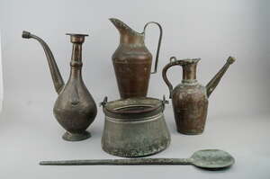 
	
		A Middle Eastern copper jug, early 20th century, with long scrolling spout, 40cm high,...