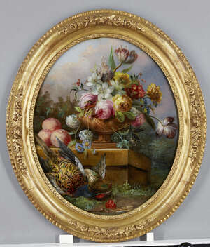 
	
		A late Victorian reverse painted oval picture on glass, depicting flowers in an urn with...