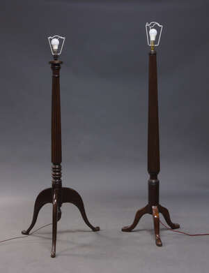 
	
		A mahogany standard lamp, early 20th Century, on reeded and turned column to curved...