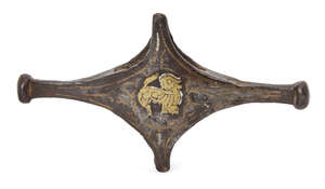A bronze sword crossguard with brass lion, 
Iran, 12th-14th century, 
of cruciform shape, with...