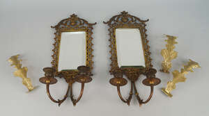 
	
		A pair of brass two branch girandoles, 20th century, the frames of pierced design...