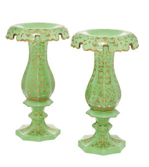 
	
		A pair of Continental facetted green and gilt glass vases, 19th century, with curling...