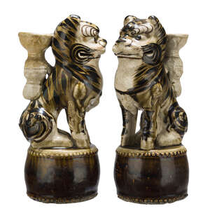 A pair of Chinese pottery Cizhou incense holders, Ming dynasty, modelled as tigers seated on a drum, 27cm high
		Provenance: Paper labels for L.Wannieck Paris