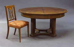 
	
		A mahogany and inlaid extending dining table, first half 20th Century, the circular table...