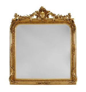 A French giltwood overmantel mirror, last quarter 20th century, with floral and scroll-carved...