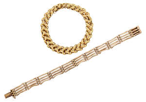 
	
		Two bracelets, one of fancy link design, length 21.0cm; the other of gate link design,...