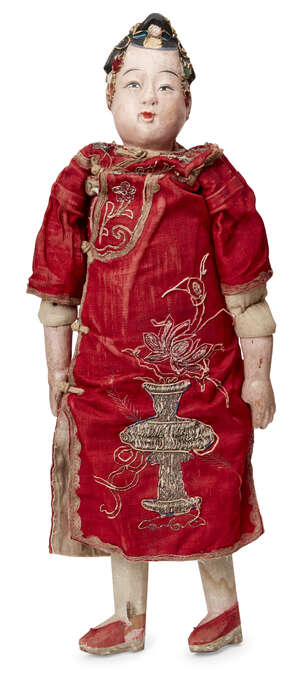 A Chinese composite female doll 
Early 20th century
With painted features and wearing a red silk...
