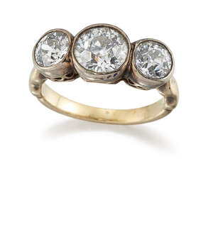 
	
		A diamond three stone ring, the three old brilliant-cut diamonds in collet mounts to a...