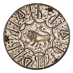 
	
		A large underglaze painted pottery bowl with lion, possibly Spain or North Africa, 19th...