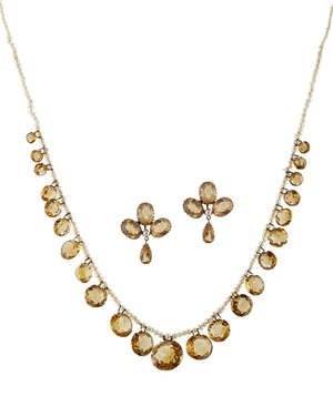 An early 20th century citrine and seed pearl necklace and a pair of earrings, the single row or seed pearls suspending a graduated fringe of circular mixed-cut