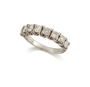 A diamond half eternity ring, composed of eight claw-set circular-cut diamonds, approximate total weight of diamonds 1.20 carats, to a plain slightly tapering 