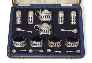 
	
		A George V silver and blue glass condiment set, London, c.1918, Reid & Sons., in original...