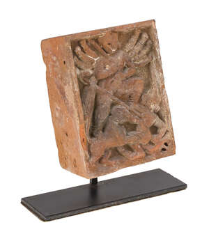 
	
		A terracotta carved brick depicting Durga killing the buffalo demon, Gupta period, of...