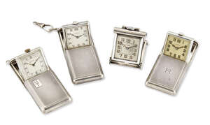 
	
		Four silver purse watches, all with rectangular engine turned slide action cases, three...