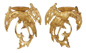 
	
		A pair of George II giltwood and gesso Ho-Ho bird wall brackets, each with a shell...