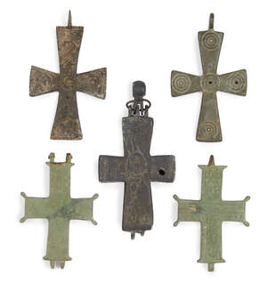 
	
		A group of Byzantine bronze cross pendants, circa 5th-10th century, engraved with design...