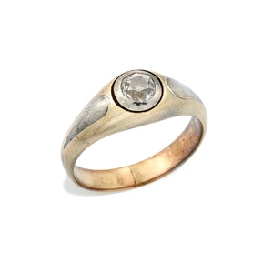An early 20th century silver and gold diamond single-stone ring, the old-cut diamond in a silver bezel setting, to a plain gold tapered mount, with applied sil