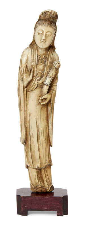 
	
		A Chinese ivory figure of Guanyin, 17th century, parcel gilt painted and carved wearing...