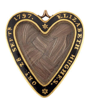 
	
		A Georgian mourning locket, of heart form, the glazed front enclosing plaited hair to a...