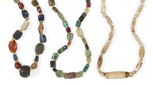 
	
		A group of three bead necklaces of mixed ancient and modern beads the first comprised of 