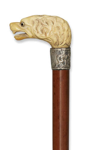 
	
		An ivory and silver walking cane, 19th century, the grip in the form of a snarling...