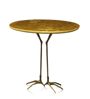 
	
		After Meret Oppenheim, a 'Traccia' table, designed 1939 
		c.1980 
		the oval giltwood...