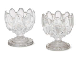 
	
		A pair of 19th Century French lobed salt cellars 
		7cm wide, (2). 
		Provenance: Brian...