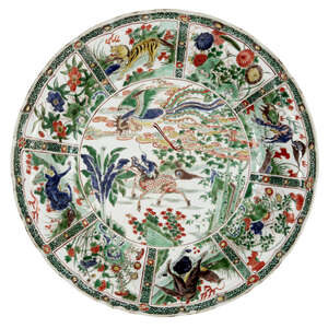 
	
		A large Chinese porcelain famille verte charger, Kangxi period, painted to the central...