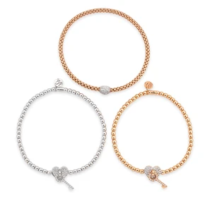 Three diamond set bracelets, each with diamond set panels, two of heart design suspending...