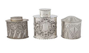A late Victorian silver tea caddy, London c.1896, William Hutton & Sons Ltd., of oval form with crimped borders and rococo chasing, 6.5cm high x 7cm wide, also