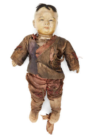 A Chinese composite doll, late 19th century, with painted facial features and wearing silk...