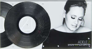 
	
		A presentation silver disc awarded to Adele for the album 21, for a million album sales...