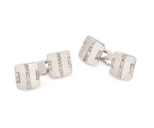 A pair 20th century 18ct white gold diamond cufflinks, composed of two bevelled plaques set with...