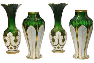 
	
		A near pair of Bohemian facetted green and opaline glass vases, mid/late 19th century, 