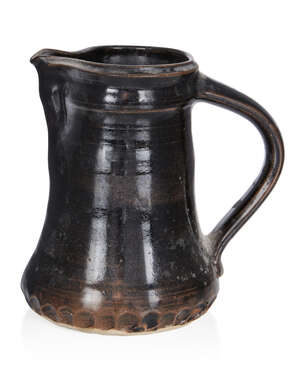 
	
		David Leach (1911-2005), 
		 
		Black jug with crimped base, circa 1970, 
		Glazed...