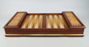 
	
		A Franklin Mint cherry wood and brass Excalibur Backgammon board with leather playing...