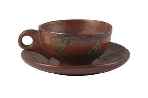 
	
		A Tophane ware pottery cup and saucer, Turkey, 19th century, red earthenware with gilt...