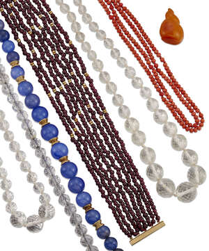 A collection of bead necklaces, including: a coral, corallium rubrum, double-row; a polished garnet eight row to a slide clasp; a faceted garnet single-row; tw