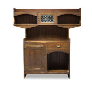 
	
		Liberty & Co, an Arts & Crafts oak cabinet with leaded glass
		c.1905, applied tag...